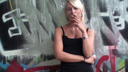 Femdom Austria: Lovely blonde teen smoking a cigarette outdoors