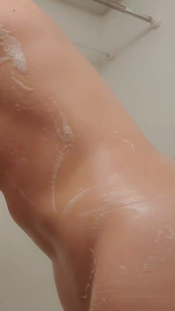 Asian Woman Plays with Oil in Bathroom