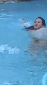 Hot Young Shemale Gets a Naked Swim in the Pool