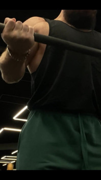 Doing a Biceps Curls with a Straight Barbell