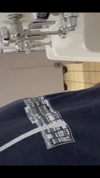 Pissing at a urinal with no dividers.