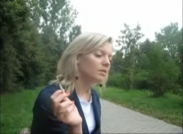 Femdom Austria: Blonde beauty smoking a cigarette outdoors