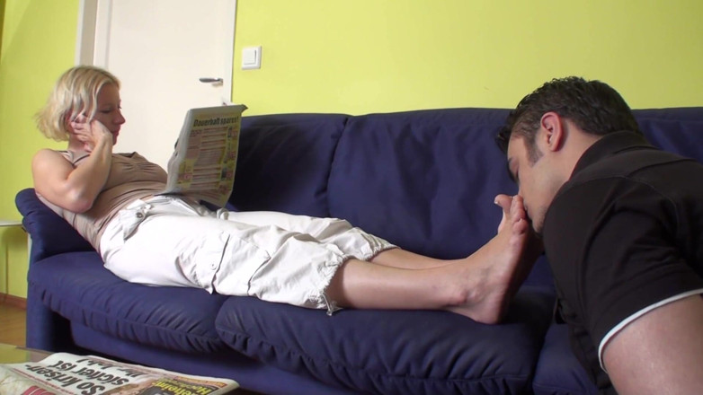 Foot Girls: Feet smelling while reading the newspaper