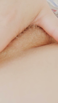 A Sexy MILF in Only Scarf Fingers Her Hairy Pussy.