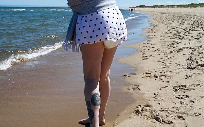 Nicole White: Nicole walks along the seashore in a wet diaper