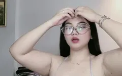 Beautiful Asian Woman Shows Off Cleavage