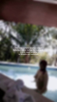 Woman Hijab Bathing Naked in an Open-air Hotel Pool