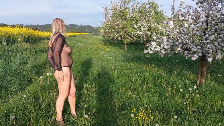 martinawest: Mature Woman Is Walking Around Outside in a See-through Bodysuit!