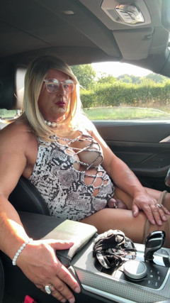Sexy Crossdresser Kellycd2022 in White Animal Print and Pantyhose Enjoying an Afternoon Drive