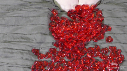 Mistress Legs: Nylon foot play with red plastic hearts in Valentine's Day