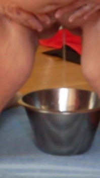 Jen Is Pissing Into a Steel Bowl