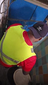 Construction Site Bathroom and Workers