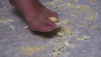 Foot Girls: Brunette crushing food in the kitchen