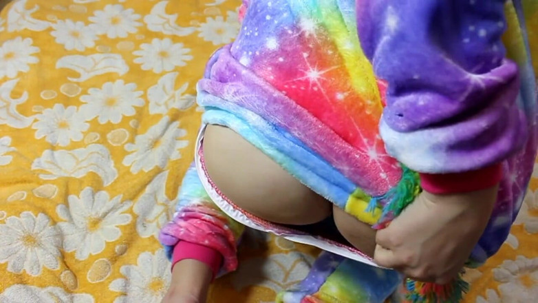 Sad Tiby: Cute girl in unicorn pajamas caresses herself with a vibrator...