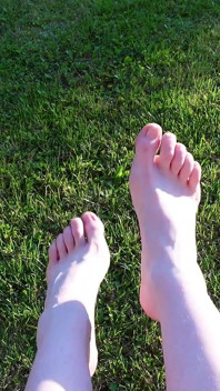 Walking with My Feet on the Grass and Showing Them to You up Close