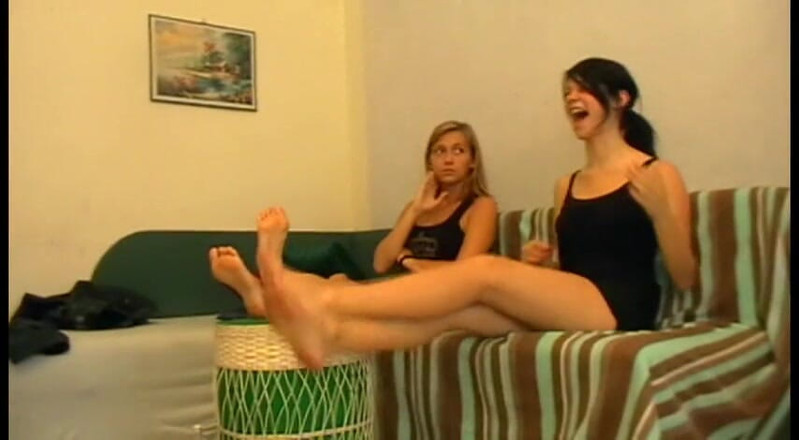 Foot Girls: Submissive masseur massaging feet of two girls