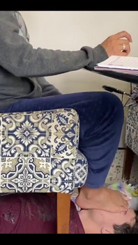 Kiffa Uses Slave as Footstool as She Uses Her Notebook