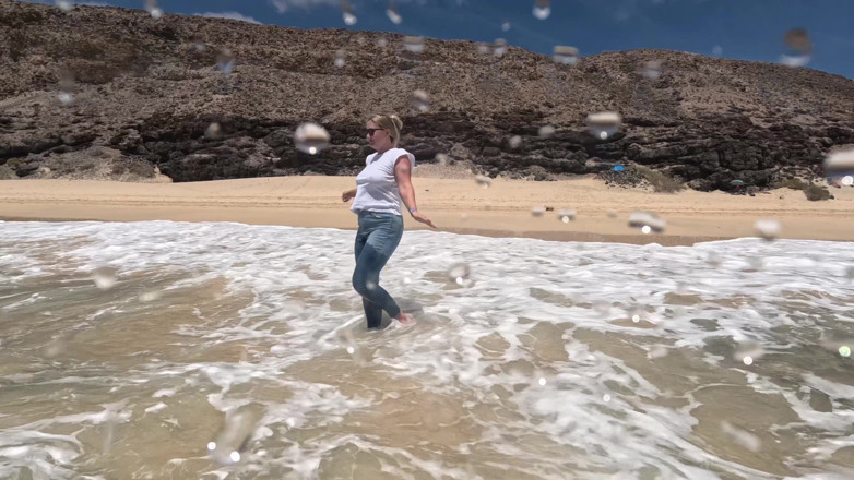 Emma Voyeur: Girl Wetting Jeans in the Ocean and Swimming in Wet...