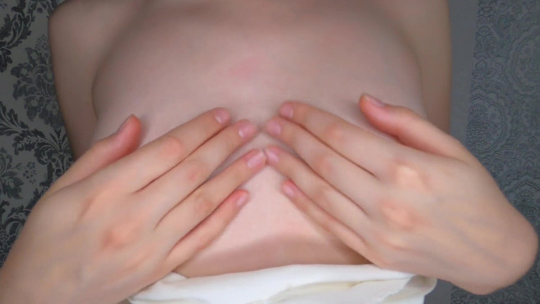 Kinodiva: Titted brunette rubs nipples with oil and plays with them