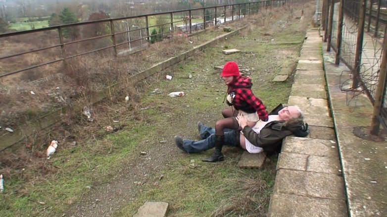 Nikky Thorne's Teen Club: Brunette fucking with old dude next to a railway