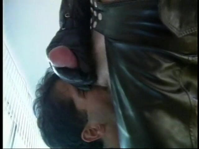 Gays Case: Hot stud in leather gear sucks his partner's dick on...