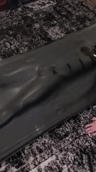 Cute twink tormented in latex vacbed