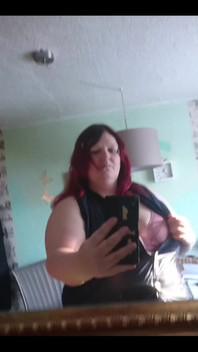 Showing off in a cool lab coat in front of the mirror