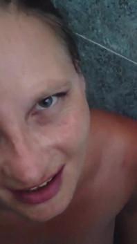 Pregnant Brunette Gets Pissed on Her Oiled Tits
