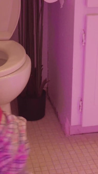 Emily pissing in the bathroom