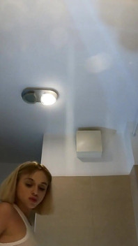 Cute and Hot Sexy Tight Pussy Cheerleader Shows Her Shaved and Wet Pussy Under Her Mini Skirt in the Bathroom