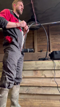 Farmer Smokes and Milks Himself with the Milking Machine