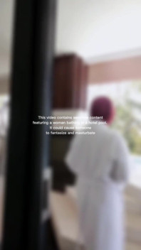 Woman Hijab Bathing Naked in an Open-air Hotel Pool