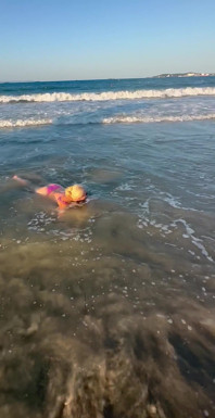 Try Not to Wet My Hair While Play with the Waves