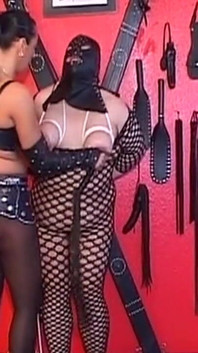 Dominant MILF Teases Her Hooded Submissive with Toys