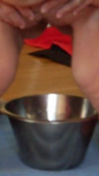 Jen Is Pissing Into a Steel Bowl