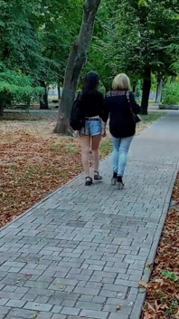 Two Lesbian Mistresses Are Strolling Through the Park