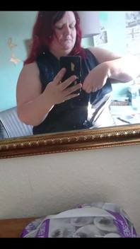 Showing off in a cool lab coat in front of the mirror