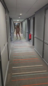 Naked in the Village Hotel Corridor