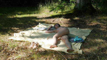 Peaches and Bananas: Naked Charlie sunbathing on a nude beach