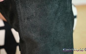 Rugged Elegance – Worn Tights and Biker Boots in a Black Minidress
