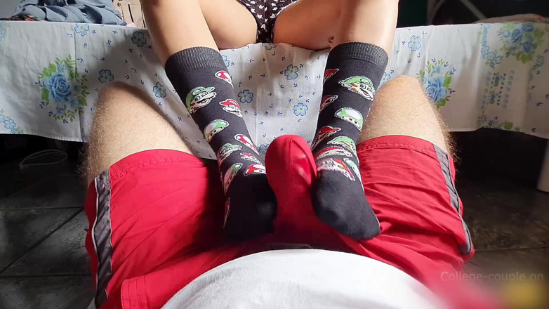 College-couple: Footjob over shorts, cum through clothes footjob, sockjob