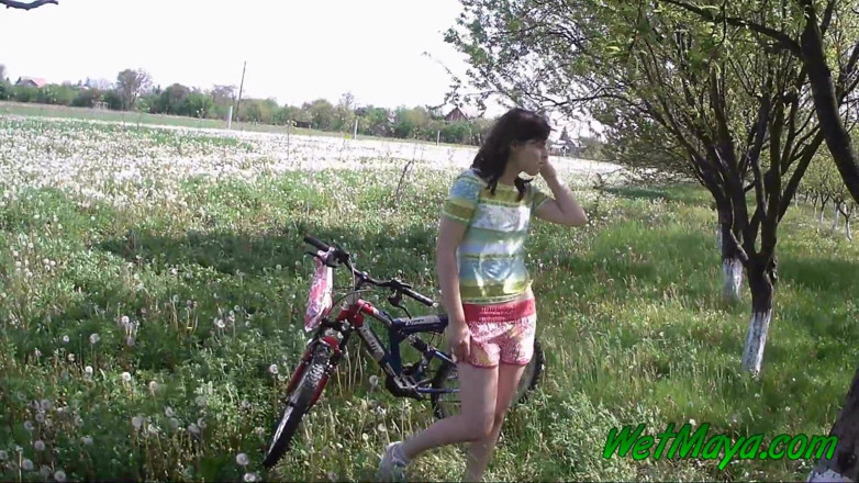 Wet Maya: Peeing on her bicycle