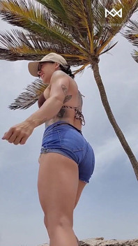 Giant Muscular Goddess on the Beach