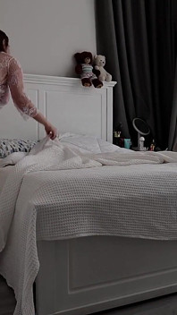 Stepmom Tidies the Bedroom. in Her Sheer White Robe