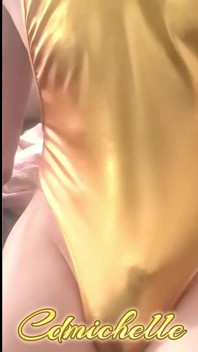 Cdmichelle Wearing Gold Bodysuit