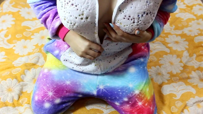 Sad Tiby: Cute girl in unicorn pajamas caresses herself with a vibrator...