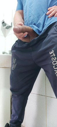 A Well-endowed Brazilian Man Urinating and Showing His Thick Penis to His Female Friends.