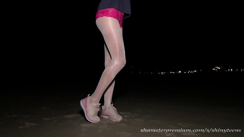 Shiny teens: Anna in white shiny pantyhose on the night beach