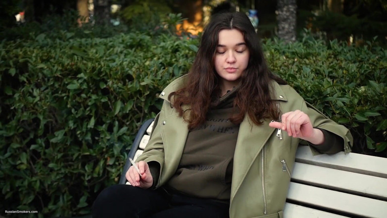 Russian Smokers: Young Brunette Is Taking an Unhurried Stroll with Allwhite 120mm Cigarette
