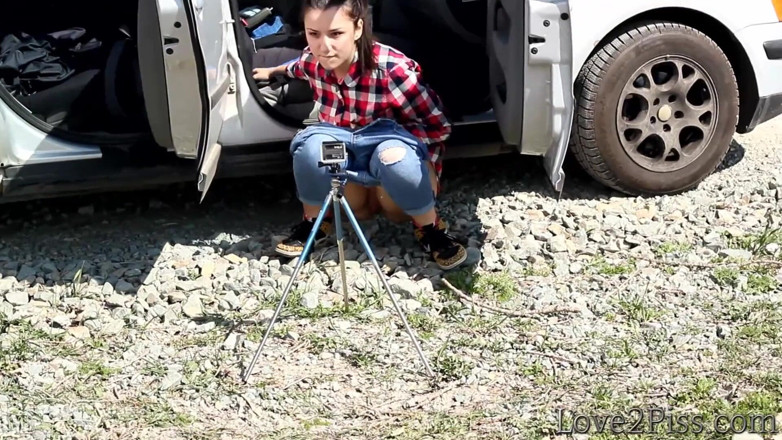Love 2 Piss: She is almost caught peeing in front of a car